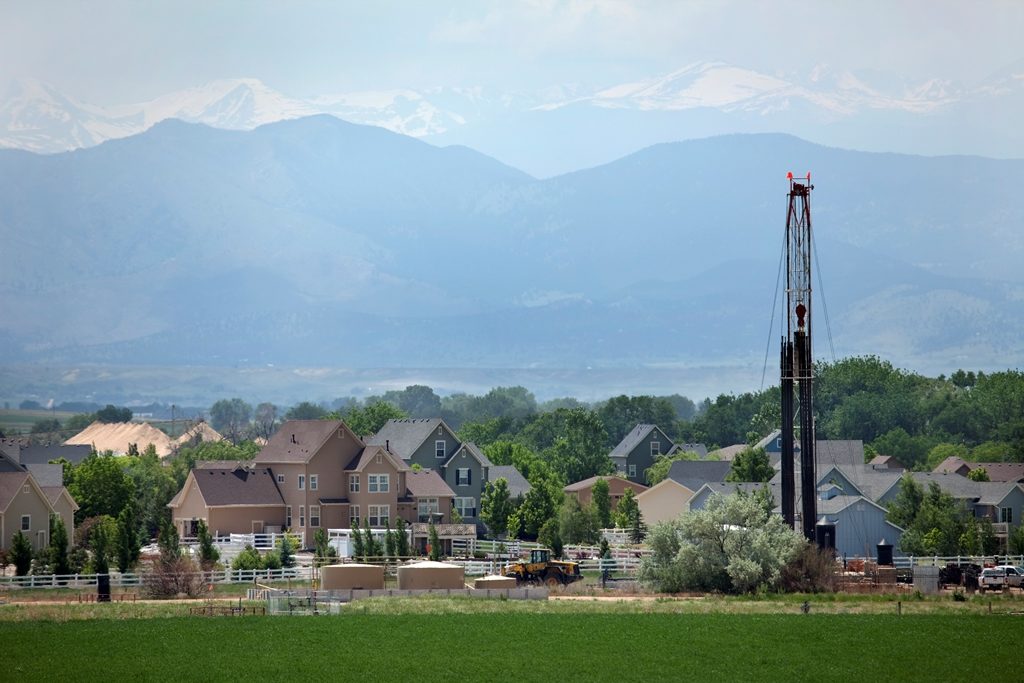 Natural gas fracking rig adjacent to neighborhood in Colorado.